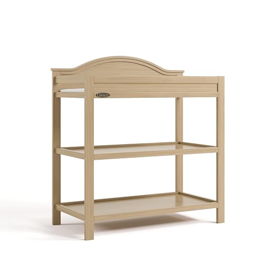 Graco Story Changing Table with Water-Resistant Pad GREENGUARD Gold Certified Baby Changing Station with Safety Strap, 2 Open Shelves, and a Nursery Must-Have Design (Driftwood)